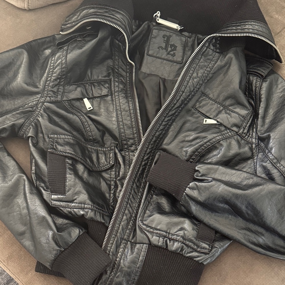 Sleek Black Leather Jacket with Ribbed Details